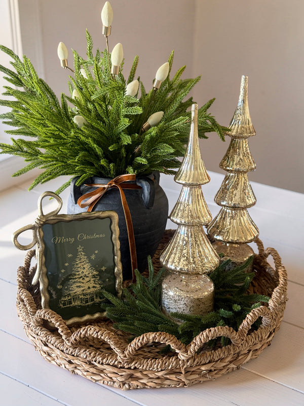 ✨ A little Christmas magic, beautifully styled. ✨ There’s something special about combining natural greenery, warm gold accents, and soft, rustic textures to create a holiday display that feels both elegant and inviting. 🤍 I love how a simple woven tray can bring everything together, creating a beautiful little moment for your coffee table, kitchen island, or entryway. It’s all about layering pieces you love and creating a home that feels warm, welcoming, and ready for the season. 🎄 How would you style this look in your home? Shop our curated holiday decor at Home Decor with Michelle 🤍 #HomeDecorWithMichelle #ChristmasDecor #HolidayStyling #CozyHome #ChristmasInspiration