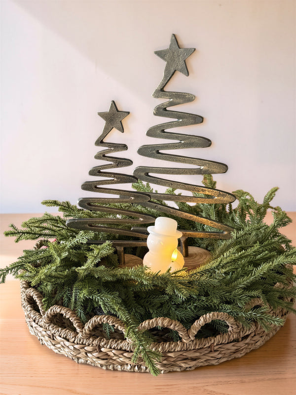 ✨ A little woodland magic for the holidays. ✨ I love how a few simple pieces can come together to create something so special. Our gold zigzag trees, a glowing snowman, and fresh-looking evergreen tucked into a woven basket make the sweetest little Christmas centerpiece. 🤍🎄 It’s warm, natural, and festive without feeling overdone — the kind of decor that makes a house feel like home. Sometimes, it’s the simplest touches that make the biggest difference. How beautiful would this look on your coffee table or dining table? ✨ Home Decor with Michelle 🤍 #ChristmasDecor #HolidayStyling #ChristmasCenterpiece #CozyHome #HomeDecorWithMichelle