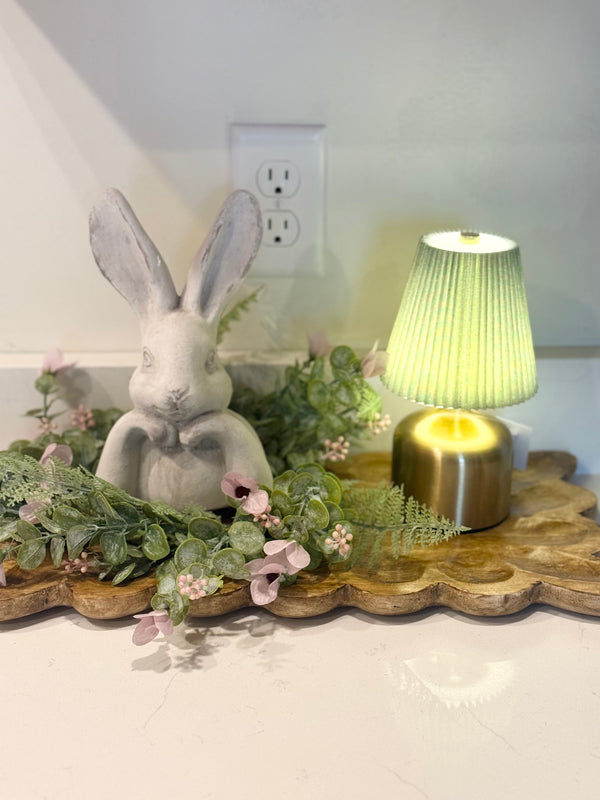 Soft lighting makes everything feel a little more special ✨Our rechargeable pleated lamp is the sweetest finishing touch for shelves, kitchen counters, nightstands, and spring vignettes. No cords. No clutter. Just a warm, effortless glow wherever you need it.Style it on a tray, tuck it beside your favorite seasonal pieces, or let it stand alone for that cozy, layered look we all love. The soft green shade adds the prettiest hint of color while the gentle light creates instant ambiance.Move it from room to room. Use it for dinners, quiet evenings, or early mornings with coffee.Beautifully styled… effortlessly. 🤍