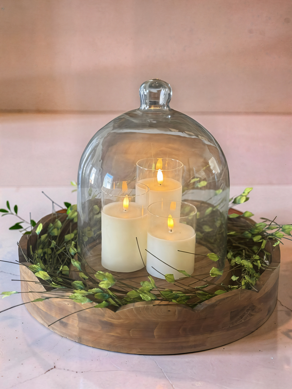 Soft glow, natural textures, and a moment of calm itLayering a simple wood tray, fresh greenery, and a glass cloche instantly creates a centerpiece that feels warm, effortless, and beautifully styled. The flicker of candlelight brings it all to life.Sometimes it's the simplest pieces that make your home feel the most invitingSave this for your next easy centerpiece idea